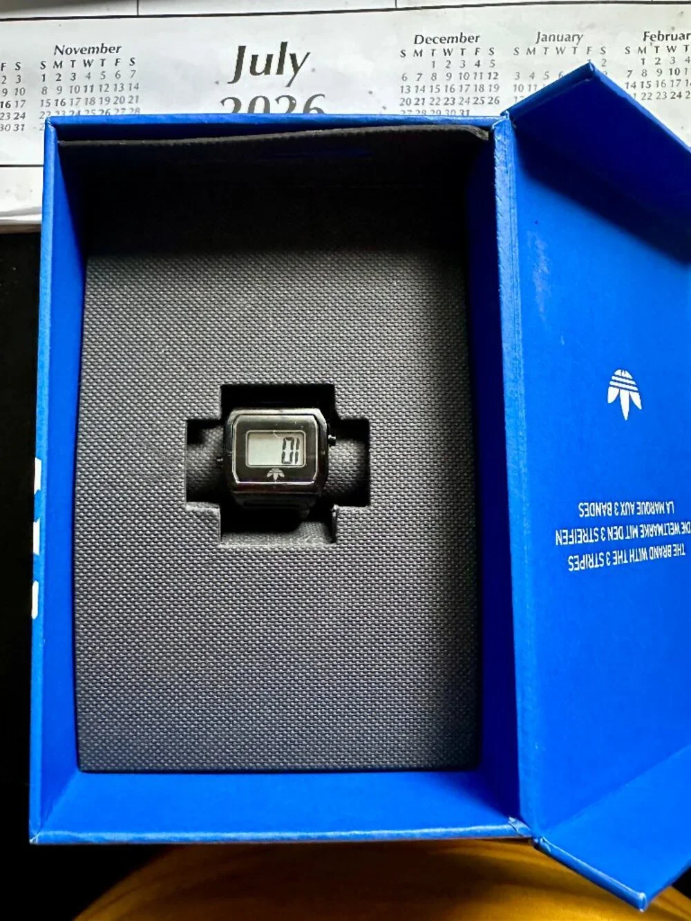 Black Adidas Originals digital two ring watch for finger